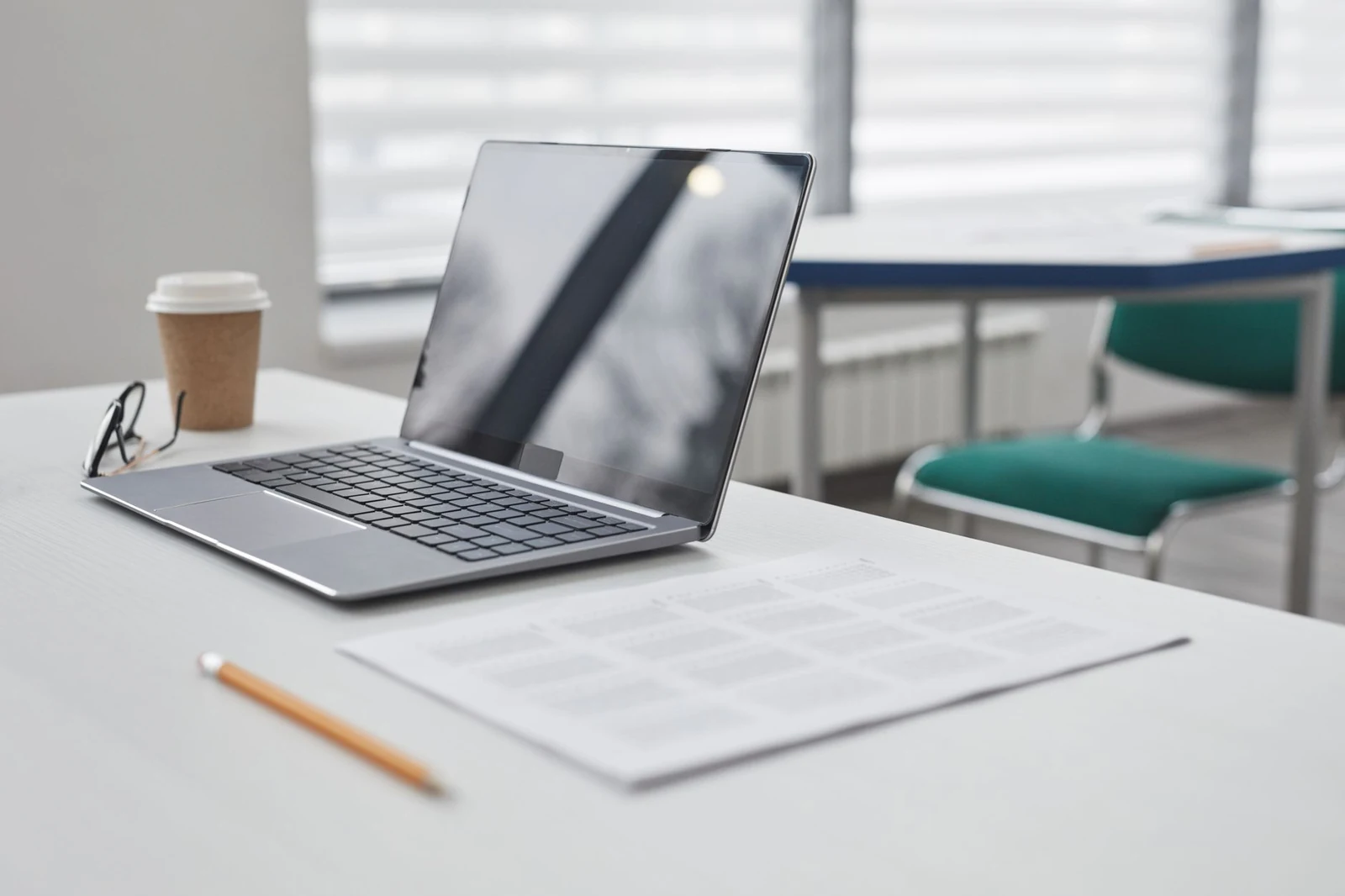 Laptop showing a short typed document on a tidy desk