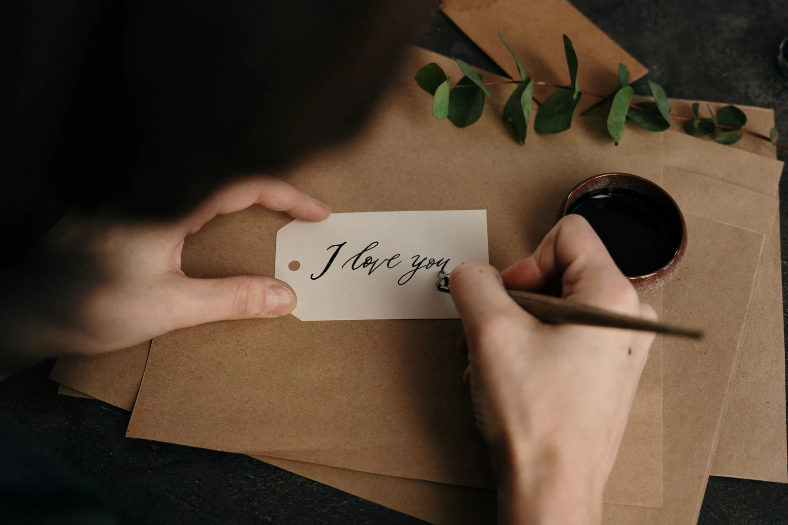 A professional noting details on a business card