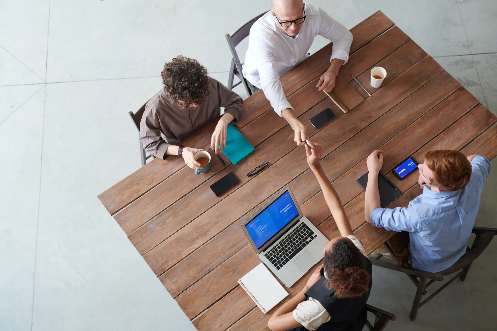 A small referral group meeting around a table