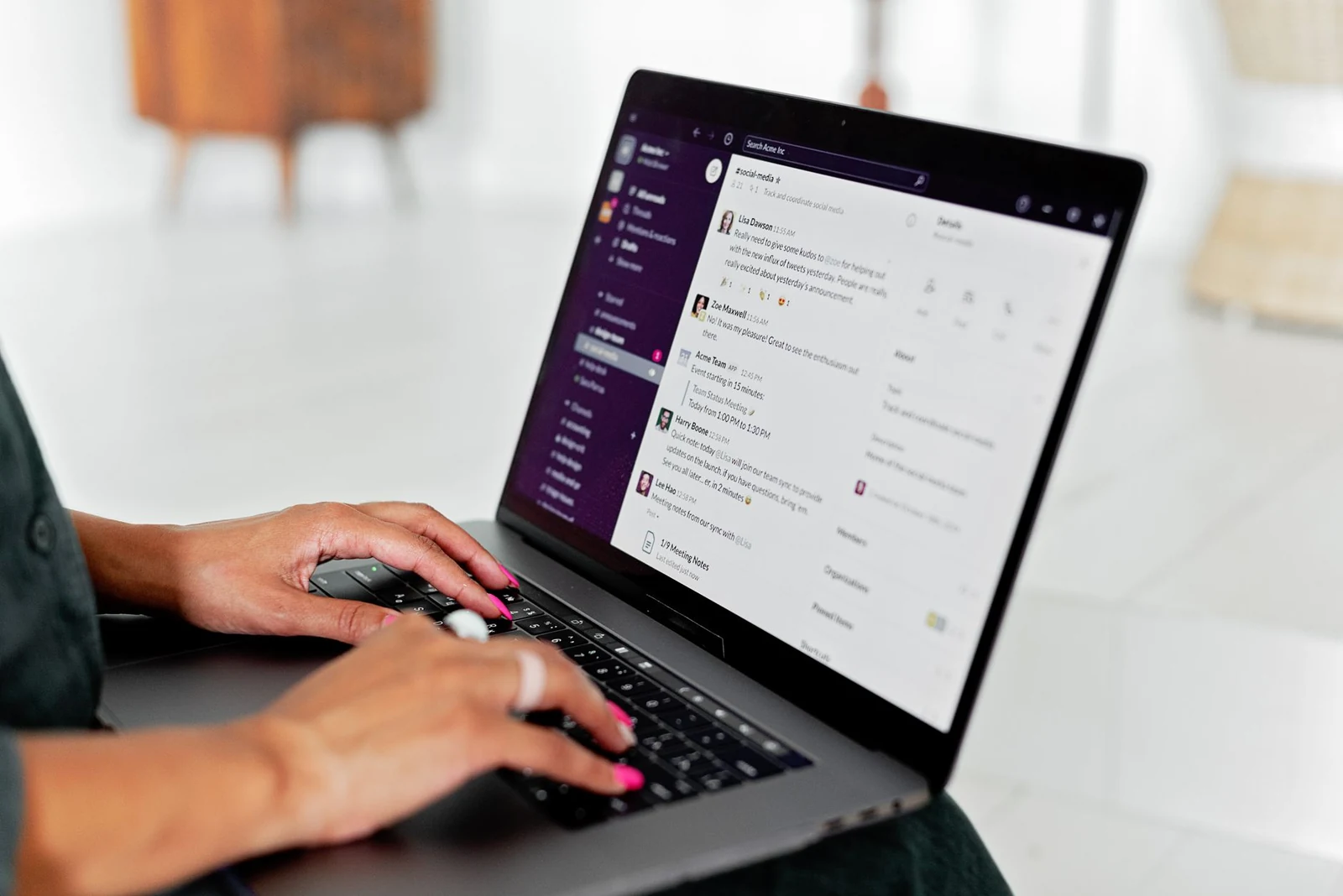 A professional writing a follow-up message on a laptop
