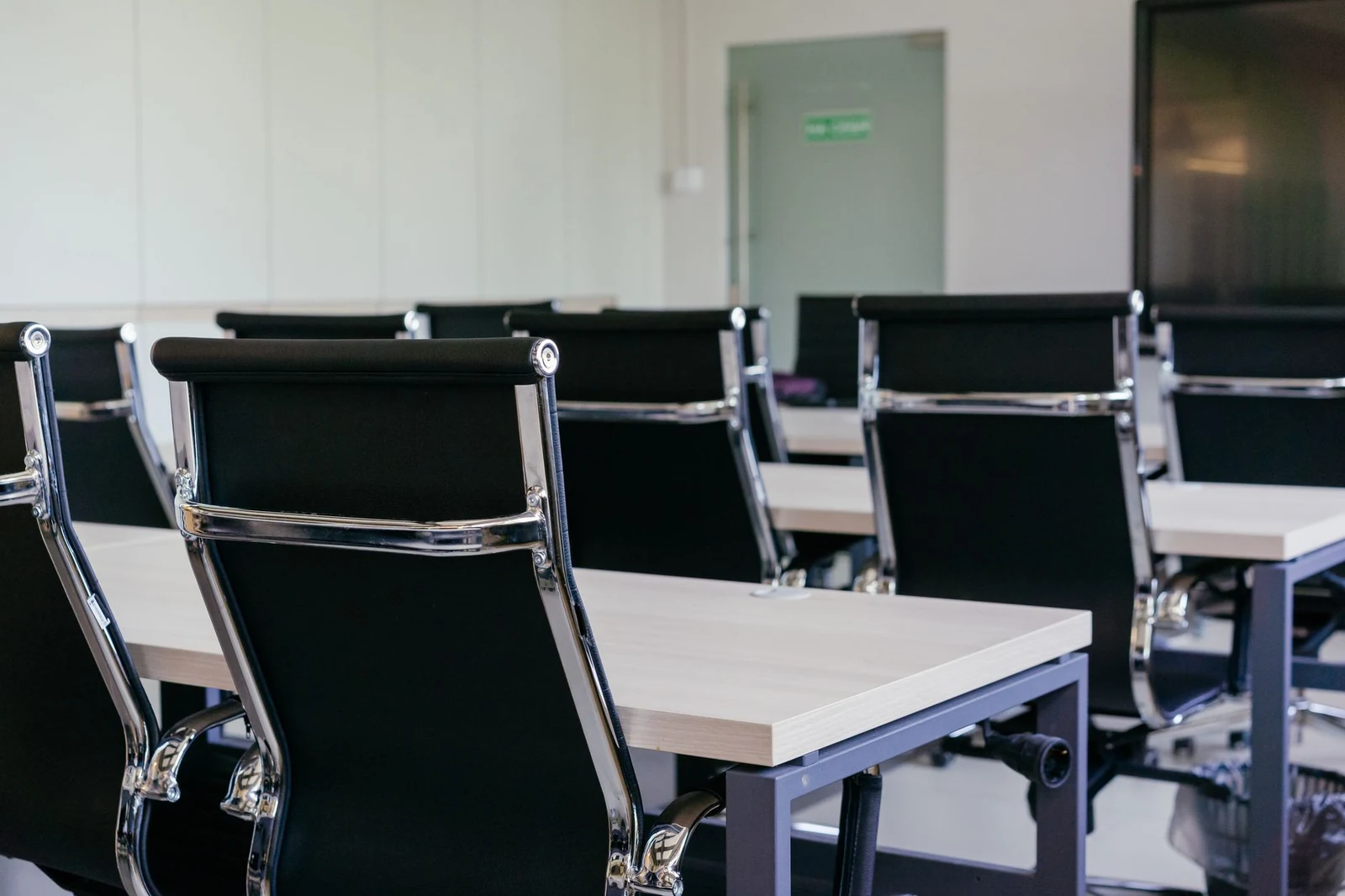 An empty desk and chair in an open office