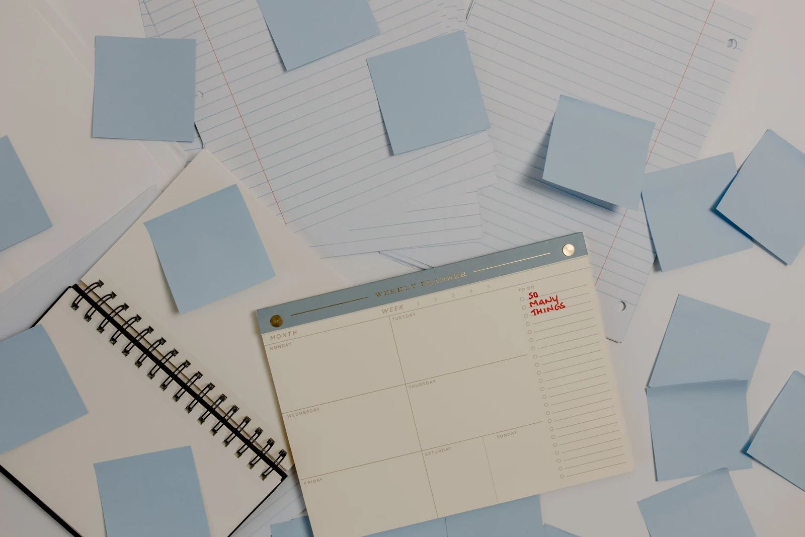 Planning interview slots Blank weekly planner surrounded by sticky notes, ready for blocking out interview slots